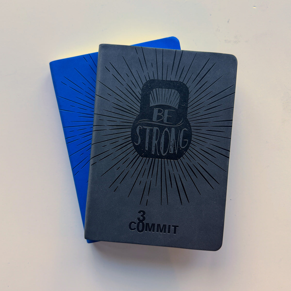 Commit30 Fitness Journals in three cover colors
