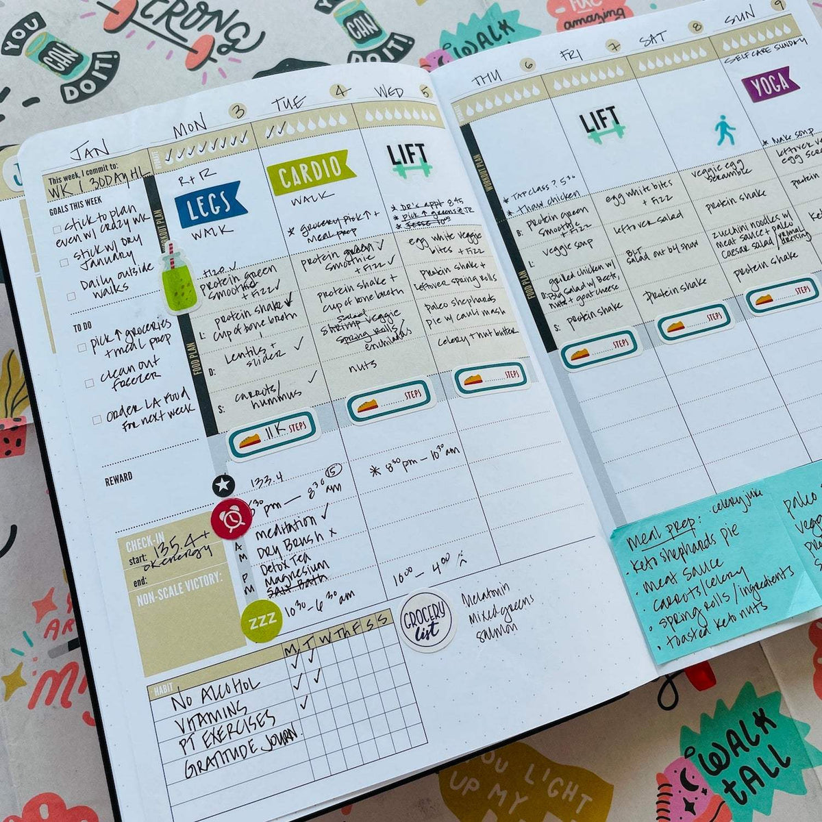 A weekly spread filled in with workouts, meals and stickers